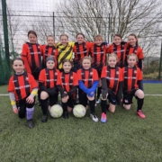 OMP United girls posing for post match team image